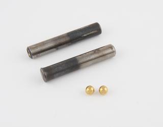 Two steel rods with and two brass spheres