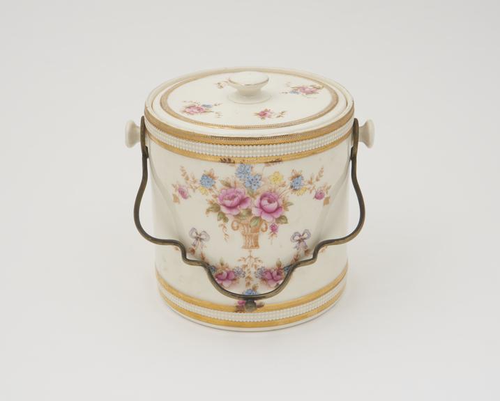 Cream-coloured porcelain floral biscuit barrel with metal