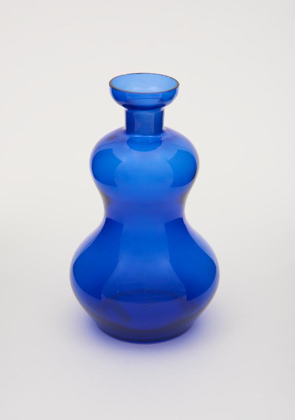 one of three blue glass bottles