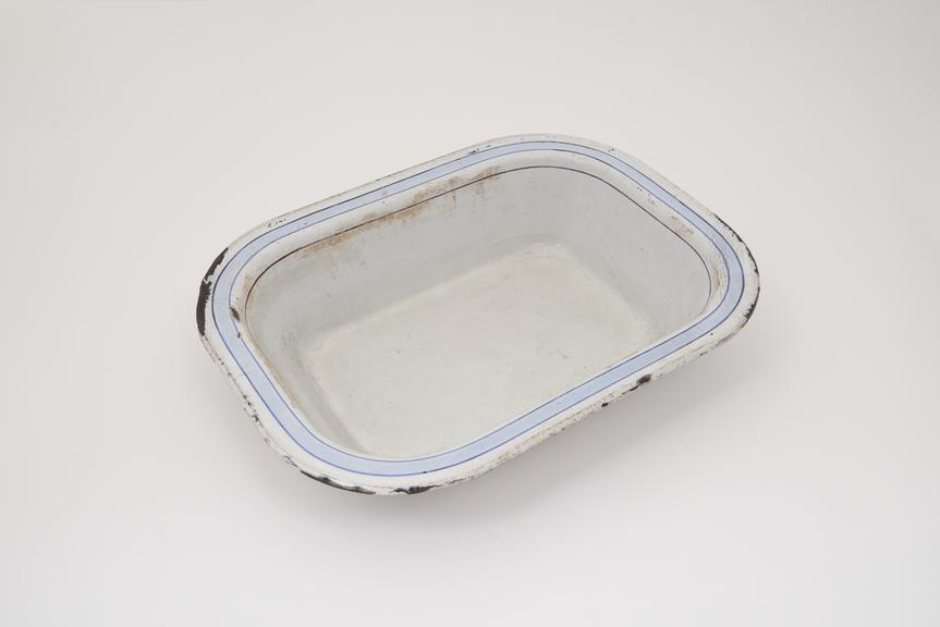 One of a selection of kitchen untensils, metal enamel dish, c