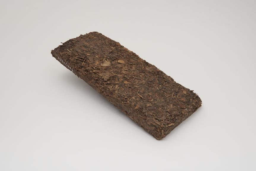 Flat rectangular brick of compacted tea, from China, 1901-1945