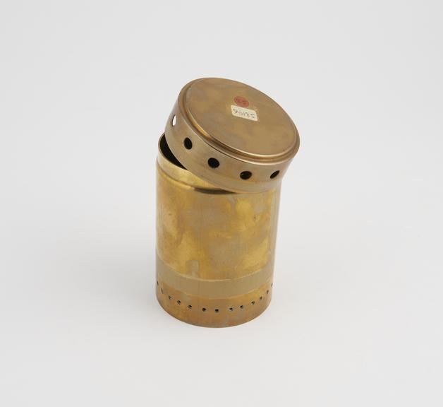 Brass heater, for use with night light. c.1900.