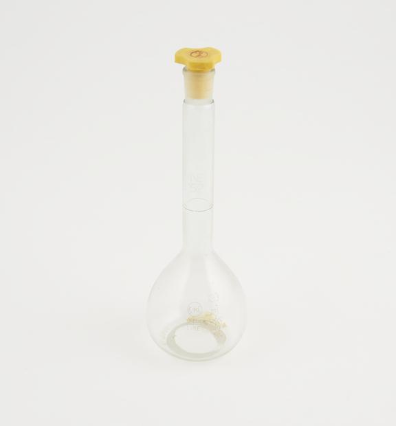 Stoppered flask 100ml complete with polythene stopper and N.P.L