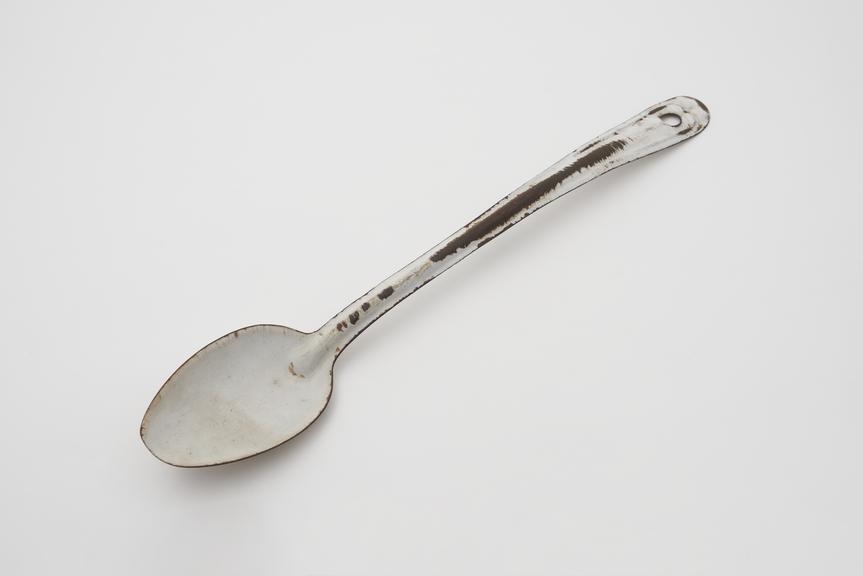 Metal enamel spoon, one of a selection of kitchen untensils, c