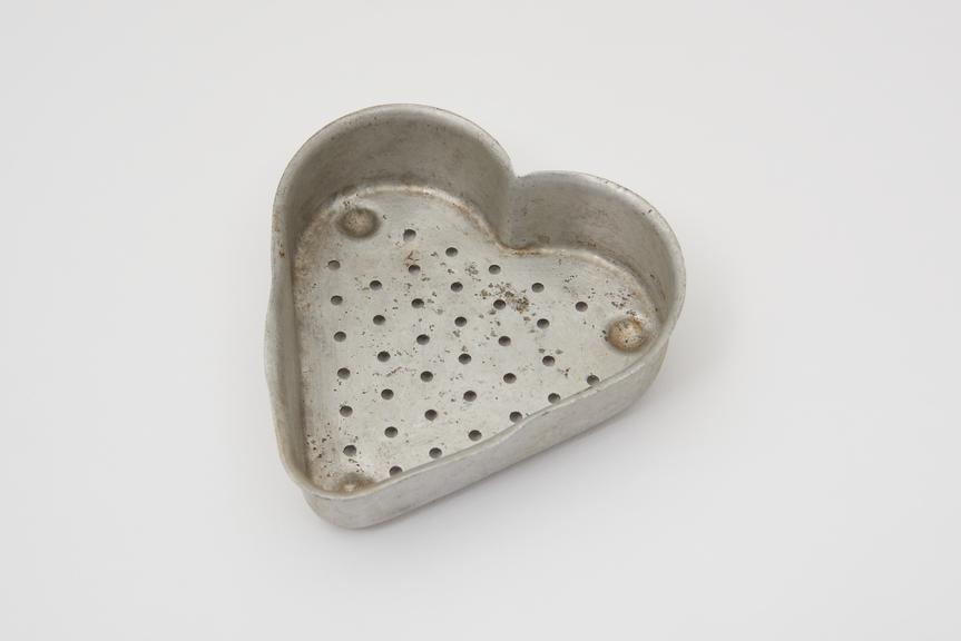 Cheese mould, aluminium, in shape of heart, c1930.