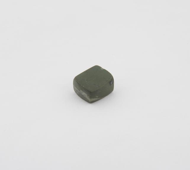 One of 14 polished stone (Chert) weights from excavations at