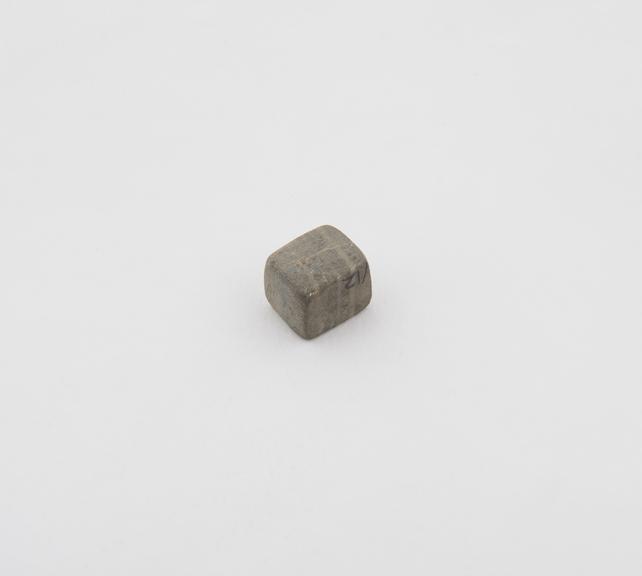 One of 14 polished stone (Chert) weights from excavations at