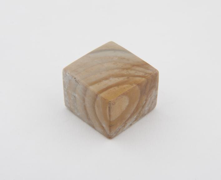 One of 14 polished stone (Chert) weights from excavations at