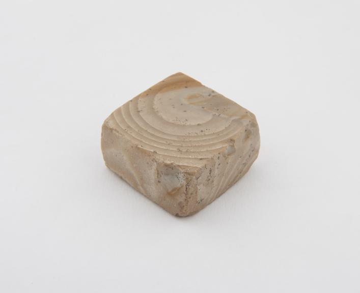 One of 14 polished stone (Chert) weights from excavations at