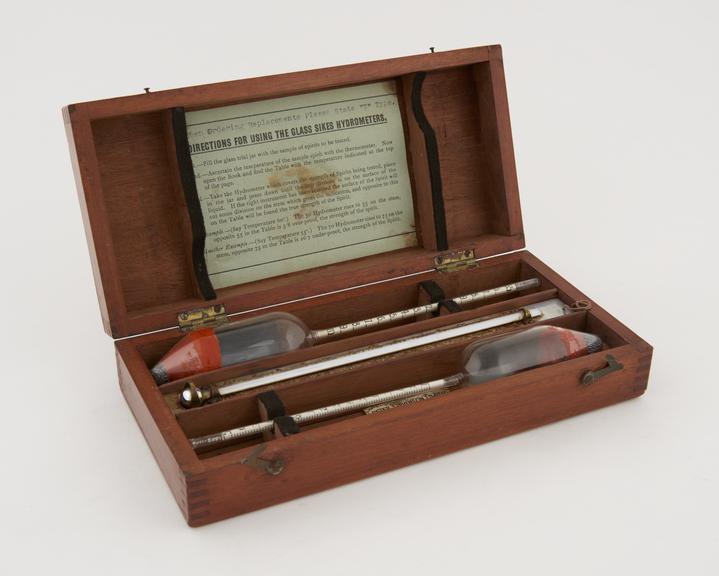 Pair of glass Sikes' hydrometers (one not original) in case