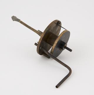 Labelled A part I - beam trap with dial at bottom to read position of crystal