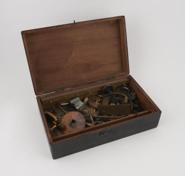 Wooden box (hinged lid) containing camera parts and accessories