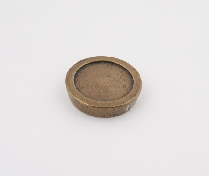 One of three disc brass weights, 2oz