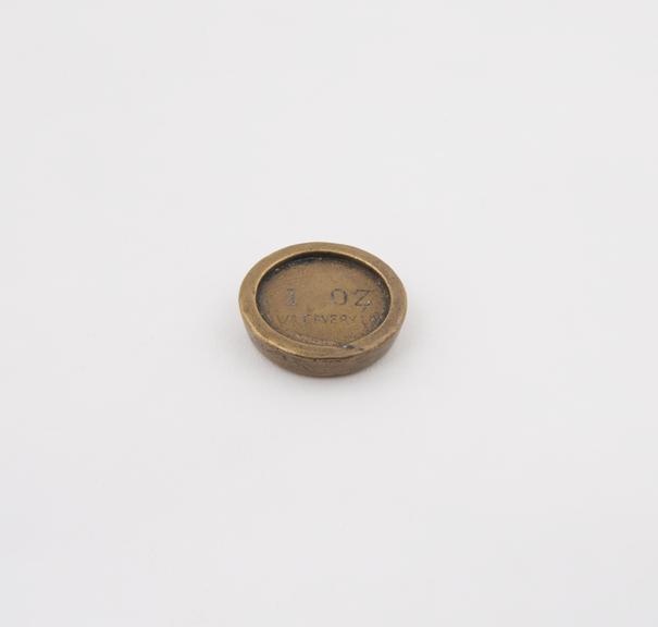 One of three disc brass weights, 1oz