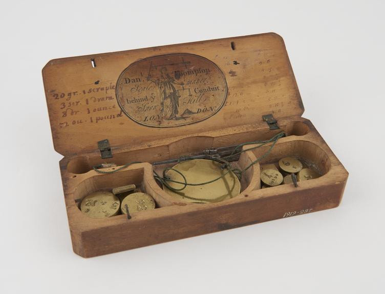 Pair of pocket scales and fourteen weights,  17th century