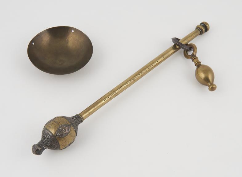 Persian steelyard in brass with silver mountings, 17th century