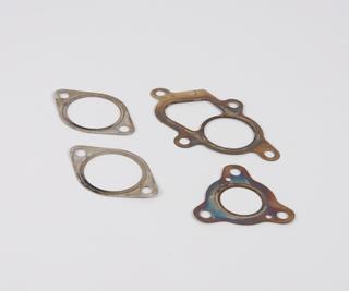 Four metal exhaust gaskets
