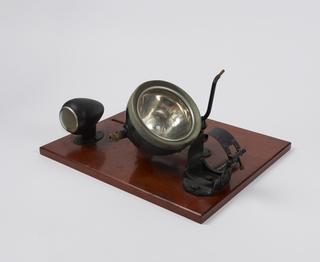 Parts of a motorcycle lighting set on a board