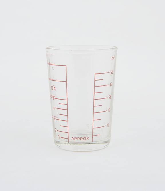 Glass measure calibrated in tablespoons' 'teaspoons' and