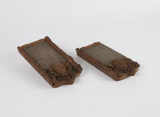 Two ornamental wooden carvings of similar sizes