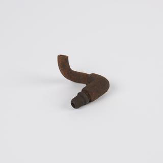 Metal curved pipe attached to an elbow connector