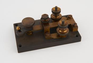 Key for reversing current through galvanometer