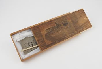 Box with instruction manual for "Locke adder"