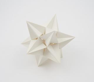 Polyhedron model showing the icosahedron and one of its 58 stellations