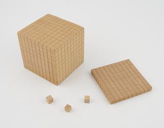 Two single wooden cubes from teaching aid