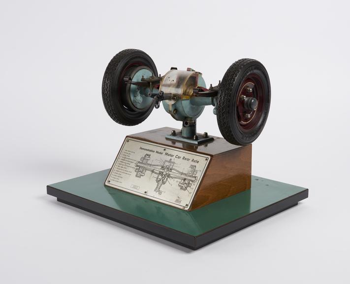 Working cutaway model of car differential wheel and axle.