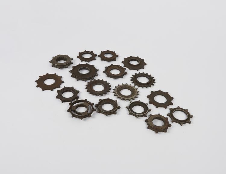 Group of seventeen small, bicycle  chain-sprocket-wheels.