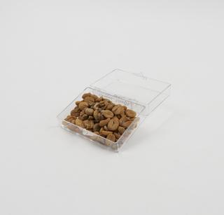 Coffee husk, ground coffee husk, and paper bag from venture to produce charcoal from coffee husks, Kenya, 1979-1981