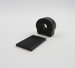 Ridged mat and cylinder made of recycled rubber, 1980s.