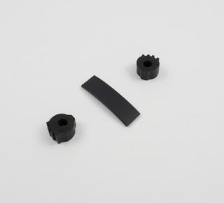 Two small cylindrical 'tyres' and rectangular strip made of recycled rubber, 1980s.