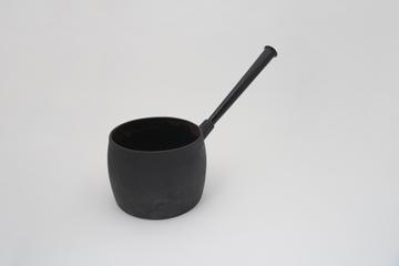 One of two large iron saucepans