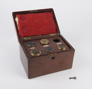 Fitted box containing lenses for 3-inch refracting telescope.