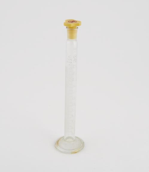 Glass cylinder, 25ml, with polythene stopper and N.P.L. certificate