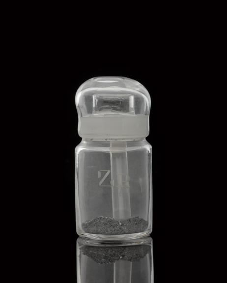 Glass-stoppered bottle containing zirconium