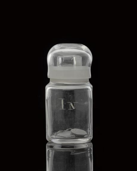 Glass-stoppered bottle containing indium