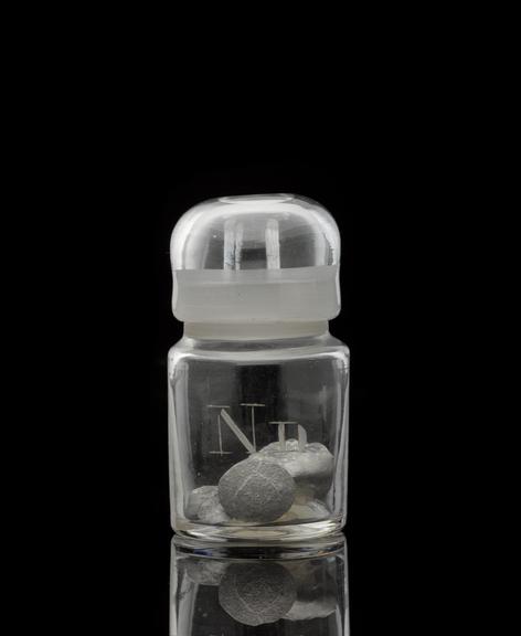 Glass-stoppered bottle containing iridium (element)