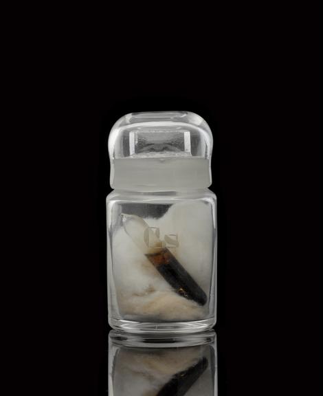 Glass-stoppered bottle containing caesium