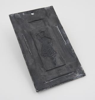 Beeswax electrotype mould covered with graphite ready for deposition of copper