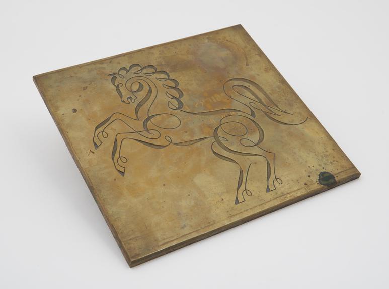 Large brass stamping die depicting a calligraphic horse