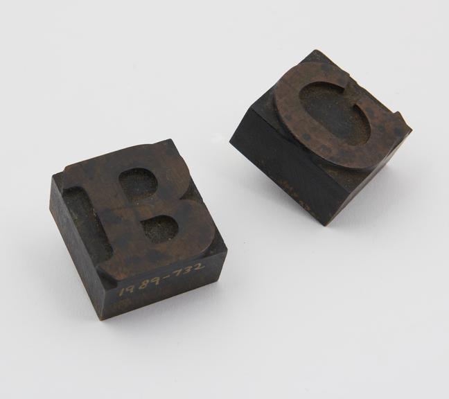 Two wood type letters 