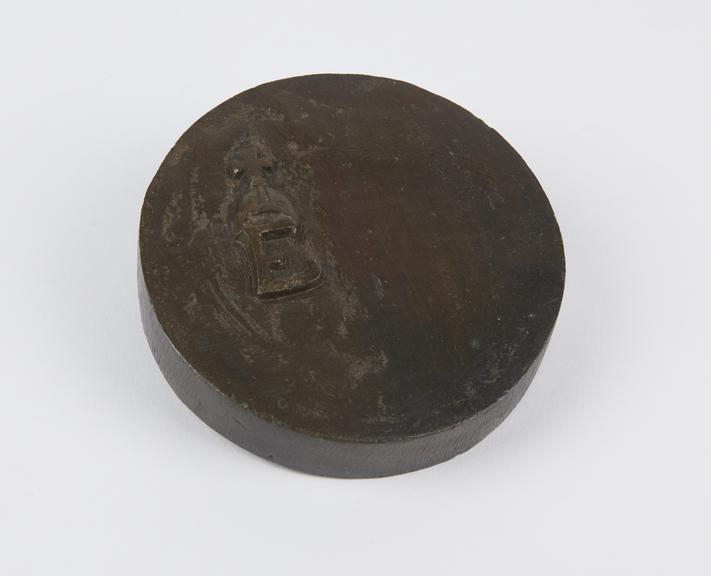 One of two flat circular bronze Avoirdupois weights, 4lb