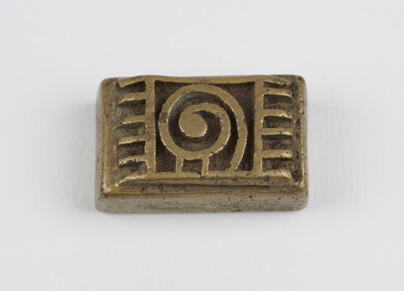 One of 84 Ashanti  brass weights in the form of a rectangular