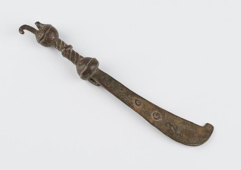 One of 84 Ashanti  brass weights in the form of a large hooked