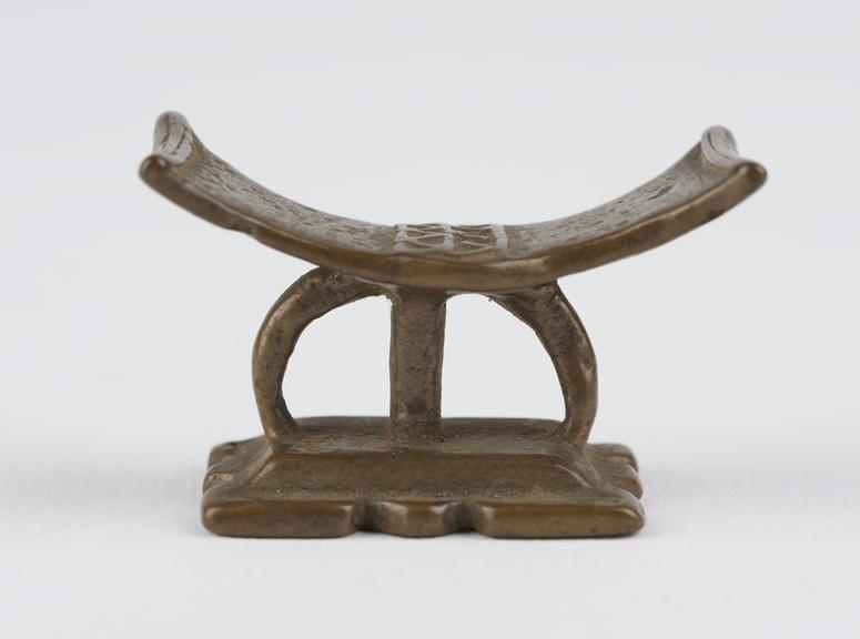 One of 84 Ashanti  brass weights in the form of a stool.