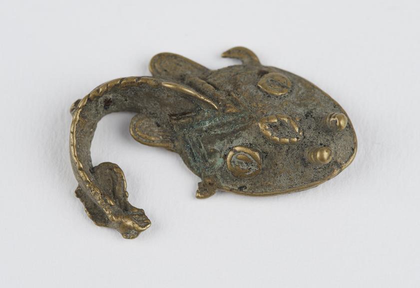 One of 84 Ashanti  brass weights in the form of a cat fish.