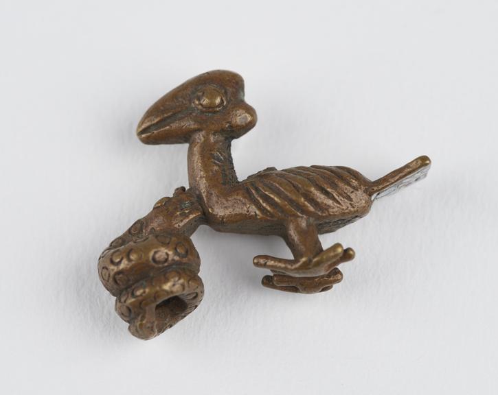 One of 84 Ashanti  brass weights in the form of a bird being